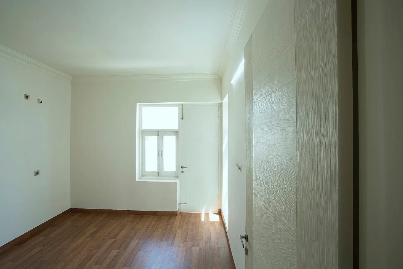 Bedroom with timber floor at Gold Floors, Sector 33, Karnal.