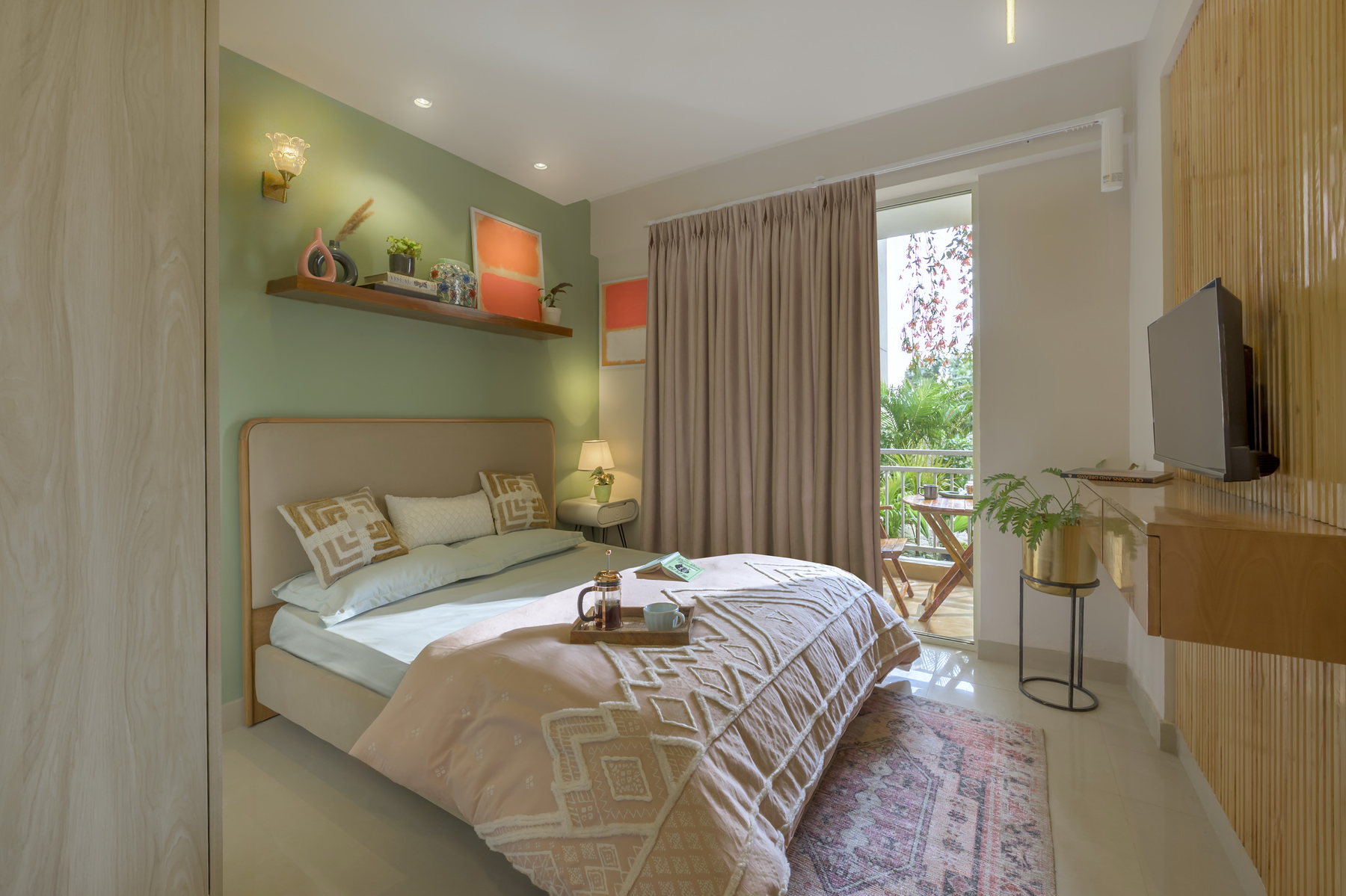 Furnished bedroom opening towards a balcony at Smart Homes Karnal.