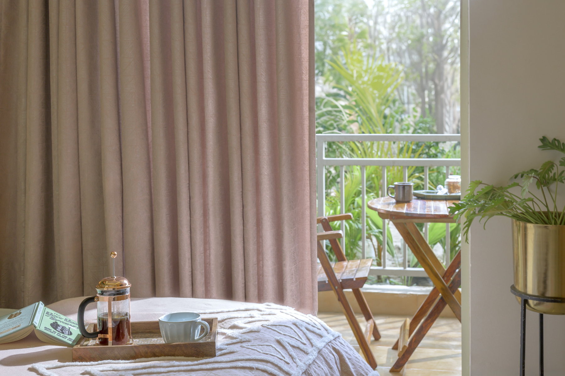 Bedroom detail looking towards a furnished balcony at Smart Homes Karnal.