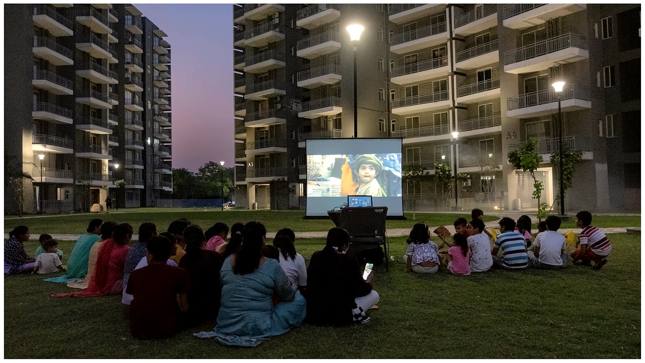 Residents gathering for an evening community screening at Smart Homes Karnal.
